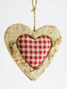 Wooden heart, squared textile in the middle