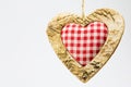 Wooden heart, squared textile in the middle