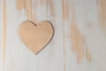 Wooden heart on wooden background. Royalty Free Stock Photo