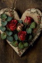 Wooden heart on a wooden wall with red roses, ai generated Royalty Free Stock Photo