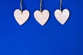 Wooden hearts on beautiful classic blue background. Valentine`s Day Greeting Card. Royalty Free Stock Photo