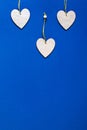 Wooden hearts on beautiful classic blue background. Valentine`s Day Greeting Card. Royalty Free Stock Photo