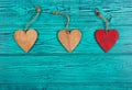 Wooden hearts on a blue background. Pendants made of wood in the form of heart. Top view Royalty Free Stock Photo