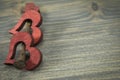 Wooden hearts and rusted nail on rustic background Royalty Free Stock Photo