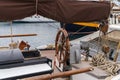 Wooden helm in the deck of a vintage vessel