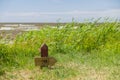 Wooden hiking trail signpost on the seacoast