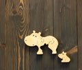 Wooden hippo family toy: mosaic mother and her kid flat on wood