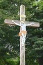 Wooden holy cross or crucifix with Jesus figure on it Royalty Free Stock Photo