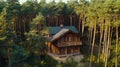 Wooden home surrounded by pines in a quiet forest. Royalty Free Stock Photo
