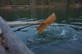 Wooden homemade oar, which row the water in the lake. Royalty Free Stock Photo