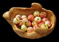 Wooden homemade vase with autumn apples isolated