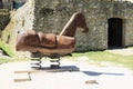 Wooden horse in front of stables on Castle Rabi