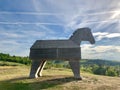 Wooden horse standing on a hill Royalty Free Stock Photo