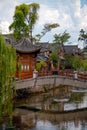 Wooden houes in Chinese style, picturesque bridge across the river in China