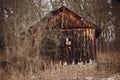 Wooden house in autumn forest. old cottage or log among trees in woods. aged wooden cabin in garden. ecotourism Royalty Free Stock Photo