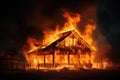 A wooden house or barn burning at night on fire Royalty Free Stock Photo