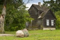 Wooden house and boulders