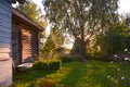 Wooden house with carved windows in Vologda Russia . Russian style in architecture. Rustic russian house with garden Royalty Free Stock Photo