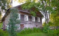 Wooden house with carved windows in Vologda Russia . Russian style in architecture. Rustic russian house with garden Royalty Free Stock Photo