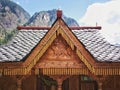 Wooden house with decorative engraving in mountains