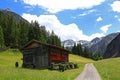 Wooden house with wooden frames for hay drying in the mountains of Austria Royalty Free Stock Photo
