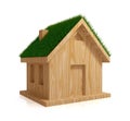 Wooden house with a green grass on a roof. Royalty Free Stock Photo