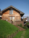 Wooden house on the green hill Royalty Free Stock Photo