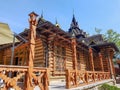 A wooden house on a green meadow in mountains. A house near old forest. Lifestyle in the Carpathian village. Royalty Free Stock Photo