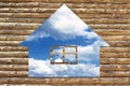 Wooden house icon on blue sky background Royalty Free Stock Photo