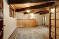 Wooden house interior with carpet floor , ceiling with wooden beams