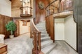 Wooden house interior with circular staircase and carpet floor