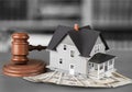 Wooden judge gavel and house and money Royalty Free Stock Photo