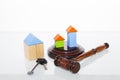 The wooden house and judge gavel on wooden table Royalty Free Stock Photo