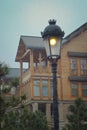 Wooden house, lantern, snow