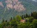 Wooden house lost in mountains forest. Atmosphere of quiet solitude.