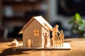 Wooden House Maquette Model with Family Couple. Generative AI Royalty Free Stock Photo