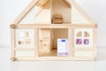 Wooden house model with 500 euro bill. House rental and sale. Expenses and costs for house handling. Housing savings concept.Copys Royalty Free Stock Photo