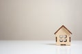 wooden house model on white table. Mini residential craft house. construction, mortgage, real estate. Housing and homeownership Royalty Free Stock Photo