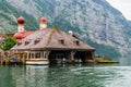 Wooden house in the mountains in Konigssee Lake, Bavaria, Alps, Germany.