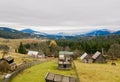 Wooden house in a mountains. Traditional small hut in Carpathian mountains on green meadow. Traditional rural landscape in Royalty Free Stock Photo