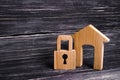 Wooden House With A Padlock. House With A Lock. Security And Safety, Collateral, Loan For A Mortgage. Confiscation Of Property