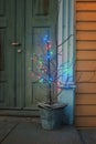 wooden house patio with a quirky christmas tree