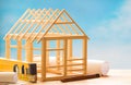 Wooden house and planning on blue sky  construction architecture abstract background concept Royalty Free Stock Photo