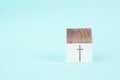 Wooden house with a religious cross, christian church, belief and faith concept, catholic and protestant community Royalty Free Stock Photo