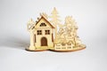 Wooden house with shapes of animal trees and people