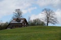 Wooden house with solar panels on the roof. Royalty Free Stock Photo