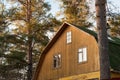 Wooden house in the summer pine forest Royalty Free Stock Photo
