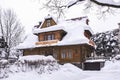 Wooden house under heavy snow, Zakopane, Poland. Royalty Free Stock Photo