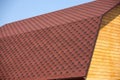 Wooden house wall and brown roof tile closeup Royalty Free Stock Photo