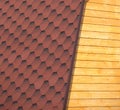 Wooden house wall and part of brown roof tile closeup Royalty Free Stock Photo